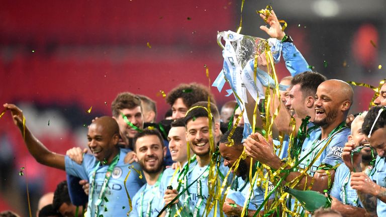 Manchester City players celebrate the Carabao Cup Final win over Chelsea on penalties