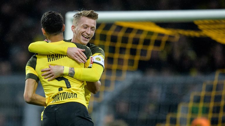 DORTMUND, GERMANY - JANUARY 26: Achraf Hakimi of Dortmund celebrates his goal for the 1-0 lead with Marco Reus during the Bundesliga match between Borussia Dortmund and Hannover 96 at the Signal Iduna Park on January 26, 2019 in Dortmund, Germany. (Photo by J..rg Sch..ler/Getty Images)