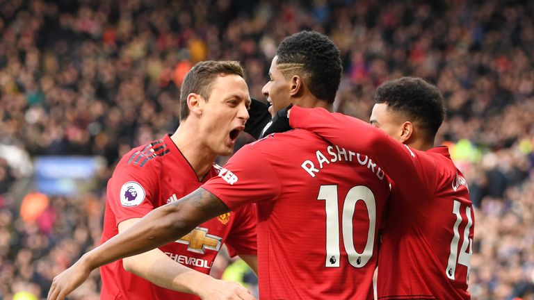 Marcus Rashford of Manchester United celebrates with teammates after scoring his team's first goal during the Premier League match between Leicester City and Manchester United at The King Power Stadium on February 3, 2019 in Leicester, United Kingdom