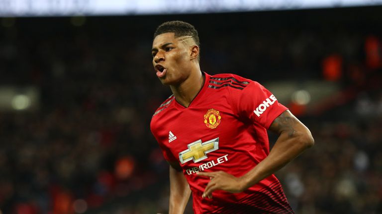 Marcus Rashford celebrates scoring Manchester United's first goal during the Premier League match between Tottenham and Manchester United at Wembley Stadium