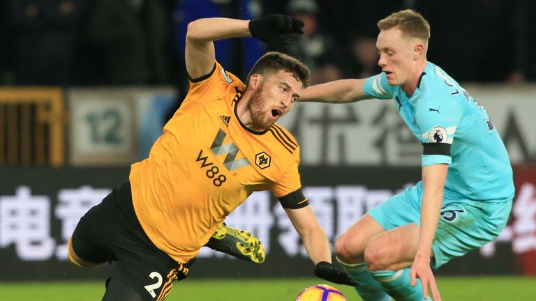 Matt Doherty goes down under a challenge from Sean Longstaff