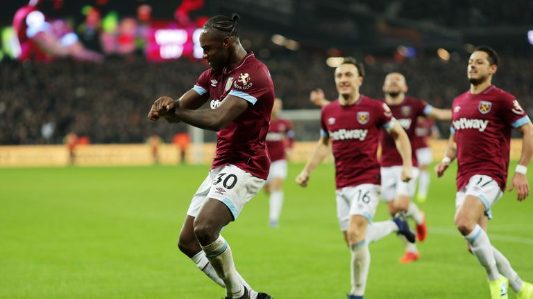 Michail Antonio celebrates hauling the Hammers level in the first half