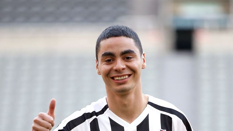 Newcastle United&#39;s new signing Miguel Almiron poses on the pitch at St James&#39; Park after his press conference