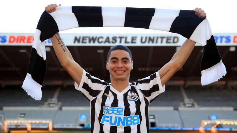 Newcastle United's new signing Miguel Almiron poses for photos on the pitch at St James' Park after his press conference 