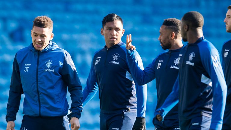 Rangers' Alfredo Morelos (centre) with James Tavernier () and Jermaine Defoe.