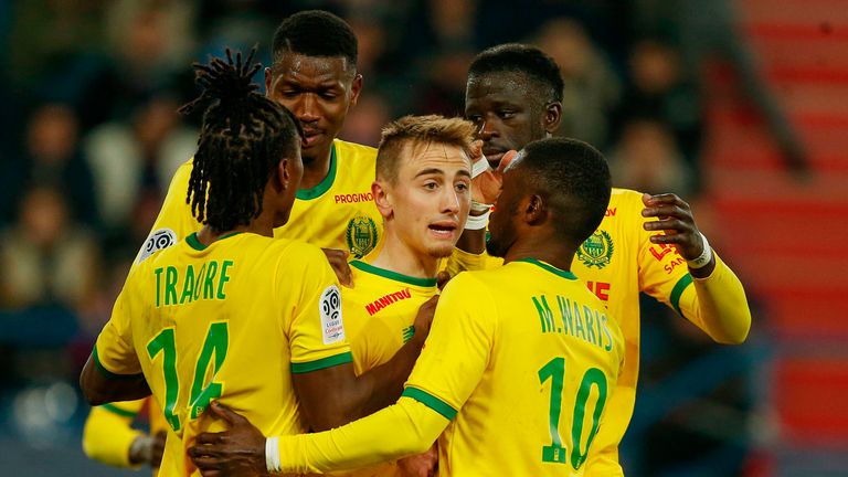 Nantes midfielder Valentin Rongier (C) celebrates with team-mates after scoring a penalty against Caen