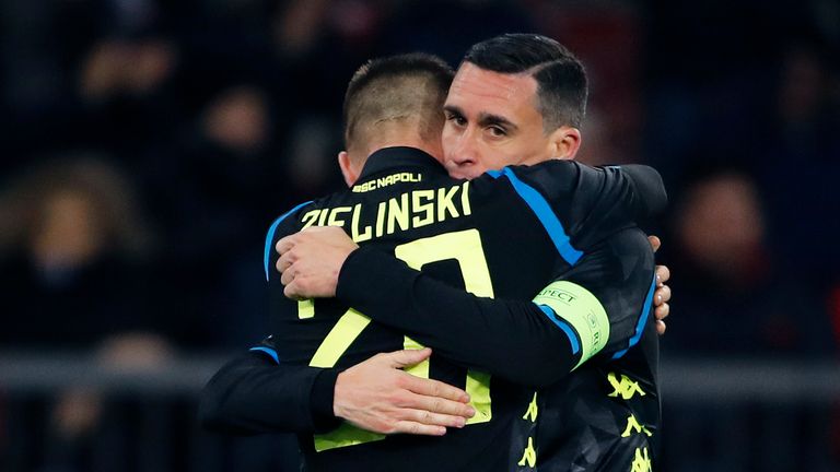 Piotr Zielinski (L) celebrates with Napoli's Spanish midfielder Jose Callejon after scoring his team's third goal 