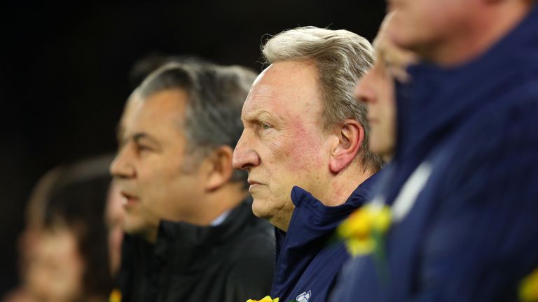 Neil Warnock and Cardiff City backroom staff observe a minutes silence in honour of Emiliano Sala