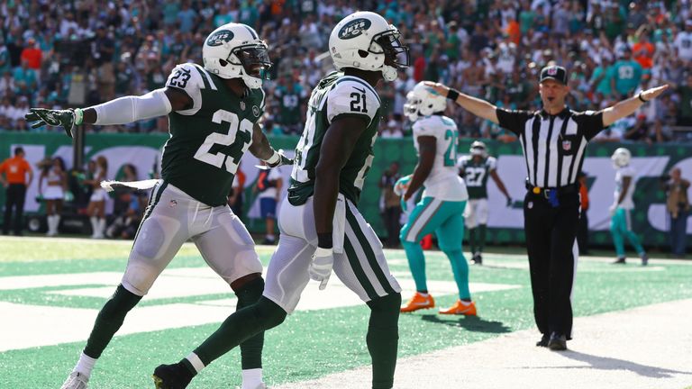 Terrance Brooks, no. 23, celebrates a touchdown with his teammate against the Miami Dolphins in 2017