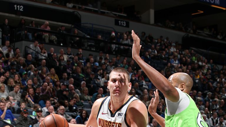 Nikola Jokic #15 of the Denver Nuggets handles the ball against the Minnesota Timberwolves on February 2, 2019 at Target Center in Minneapolis, Minnesota.