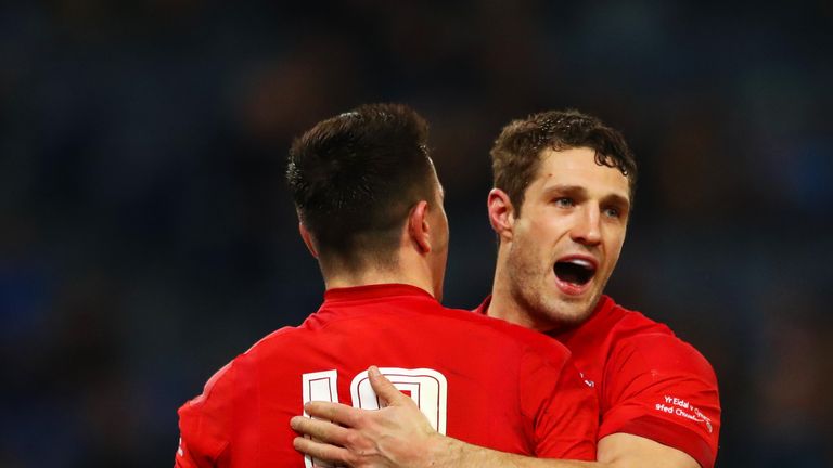 Owen Watkin (12) celebrates with Jonah Holmes after scoring for Wales against Italy