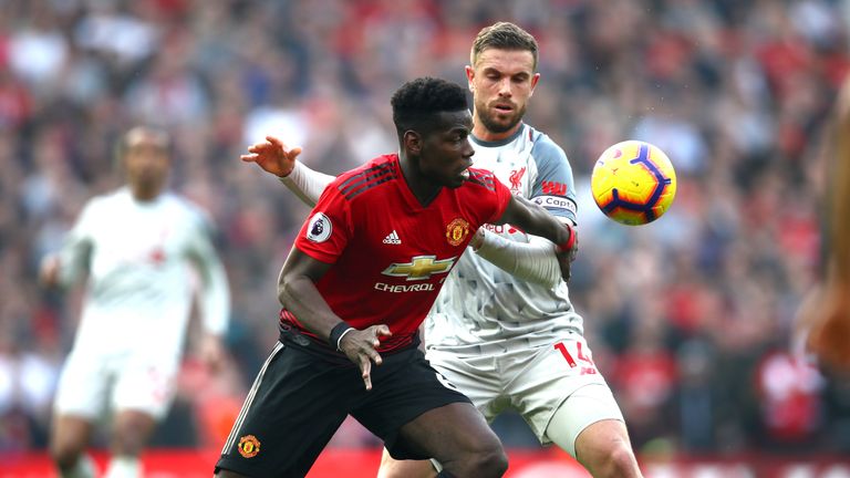Paul Pogba and Jordan Henderson in action during the Premier League match between Manchester United and Liverpool at Old Trafford on February 24, 2019