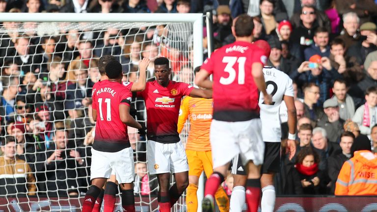 Paul Pogba celebrates with team-mates after scoring Manchester United's third goal 