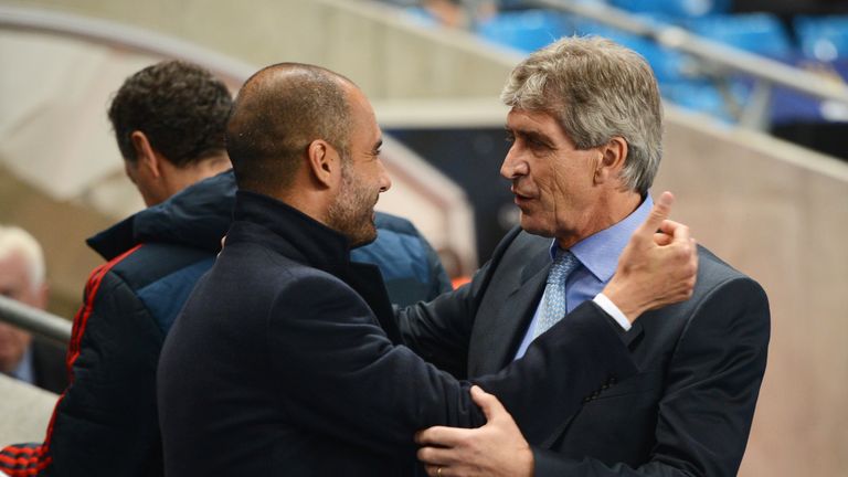 Manuel Pellegrini (R), coach of Manchester City greets Josep Guardiola, coach of Muenchen during the UEFA Champions League Group D match between Manchester City and FC Bayern Muenchen at Etihad Stadium on October 2, 2013 in Manchester, England. 