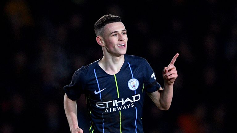 Phil Foden celebrates his second goal against Newport County