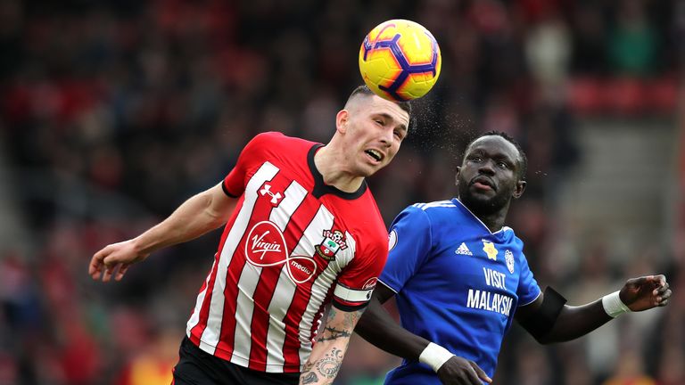 Pierre-Emile Hojbjerg battles for possession in the air with Oumar Niasse