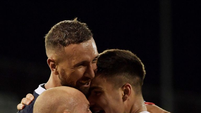 Quade Cooper and Billy Meakes celebrate with Jack Maddocks during Melbourne's win