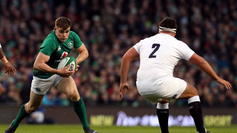 Ireland centre Garry Ringrose runs at England's Jamie George