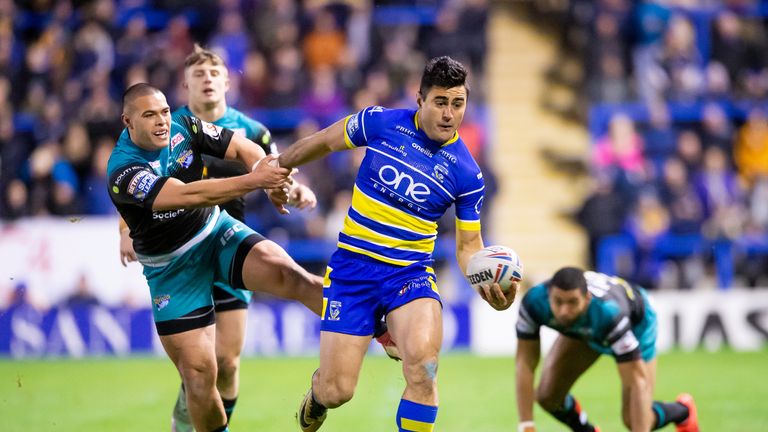 Warrington&#39;s Bryson Goodwin fends off Leeds&#39;s  Tuimoala Lolohea