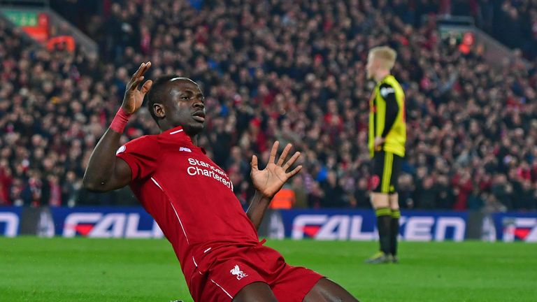 Sadio Mane slides to his knees in celebration after giving Liverpool the lead