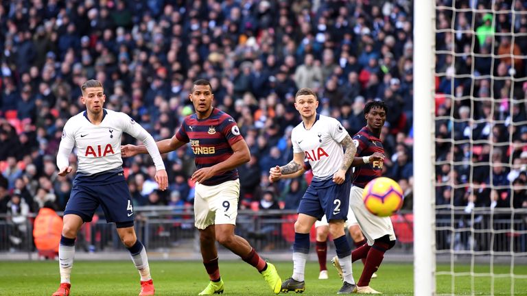 Tottenham and Newcastle players look on as Salomon Rondon's shot hits the post