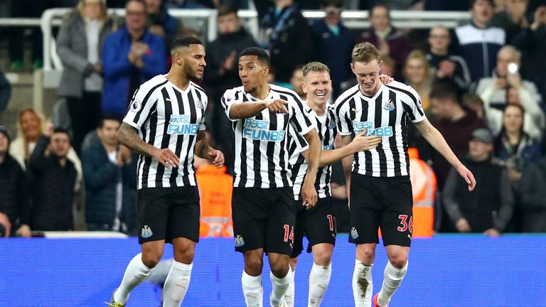 Sean Longstaff (R) celebrates with team-mates after doubling Newcastle's lead