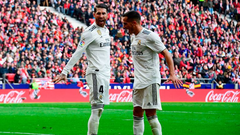 Sergio Ramos (L) celebrates with Real Madrid's midfielder Lucas Vazquez after scoring