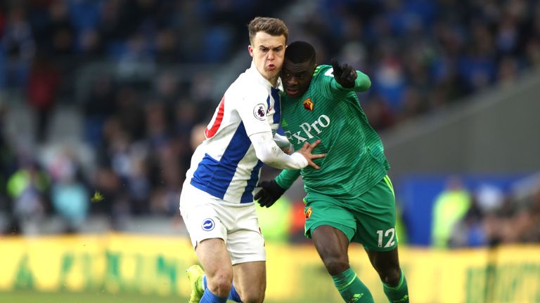 Solly March battles for possession with Ken Sema