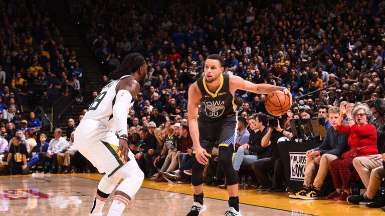 Stephen Curry of the Golden State Warriors handles the ball against the Golden State Warriors