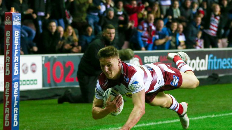 Wigan's Tom Davies scores a try against the Roosters