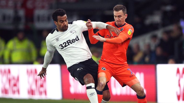 Derby County's Tom Huddlestone (left) and Millwall's Jed Wallace battle for the ball