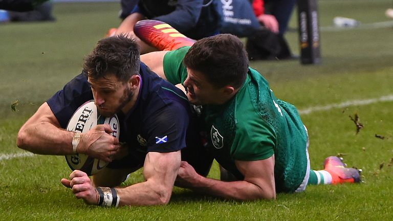 Tommy Seymour is tackled by Ireland's Jacob Stockdale