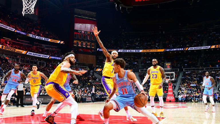Trae Young of the Atlanta Hawks handles the ball against the Los Angeles Lakers