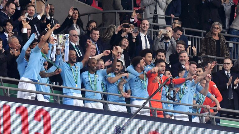 Vincent Kompany and David Silva lift the Carabao Cup trophy at Wembley Stadium