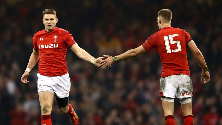 Dan Biggar of Wales (L) celebrates with Liam Williams of Wales during the Guinness Six Nations match between Wales and England at Principality Stadium on February 23, 2019 in Cardiff, Wales.
