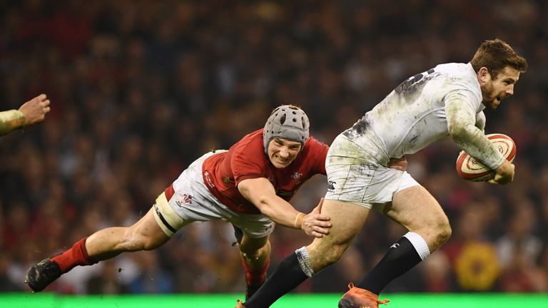 Wales' Jonathan Davies shackles England's Elliot Daly during their 2019 Six Nations clash in Cardiff