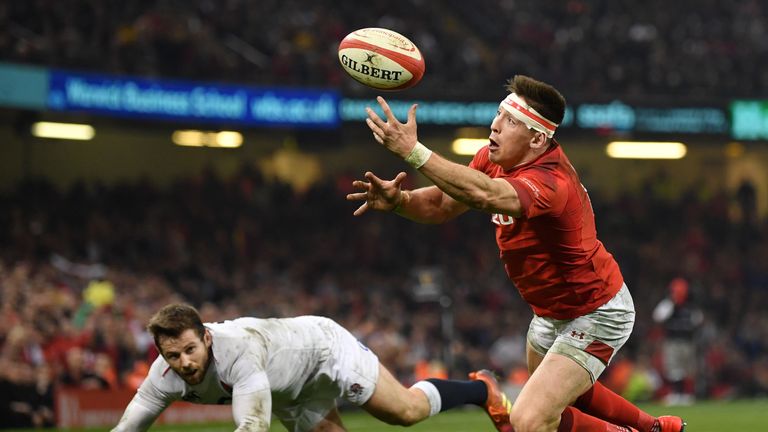 Wales' Josh Adams catches the ball before diving over to score during his side's 2019 Six Nations clash with England in Cardiff.