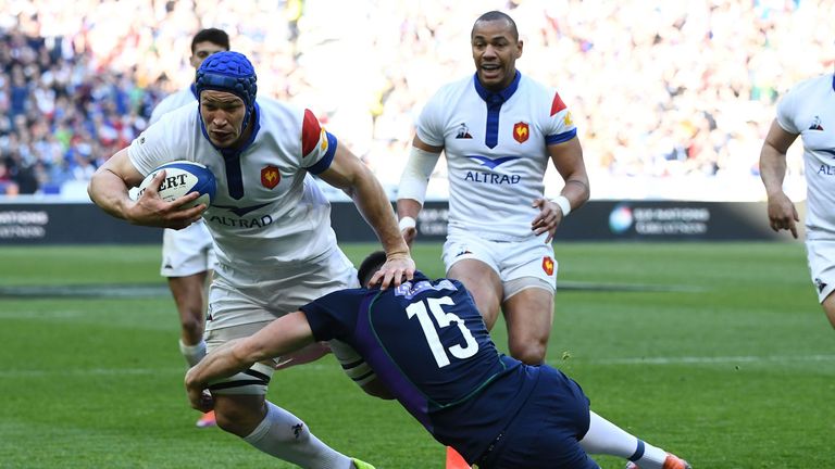 France's flanker Wenceslas Lauret (C) is tackled by Scotland's fullback Blair Kinghorn (2R) during the Six Nations rugby union tournament match between France and Scotland at the Stade de France in Saint-Denis, outside Paris, on February 23, 2019.