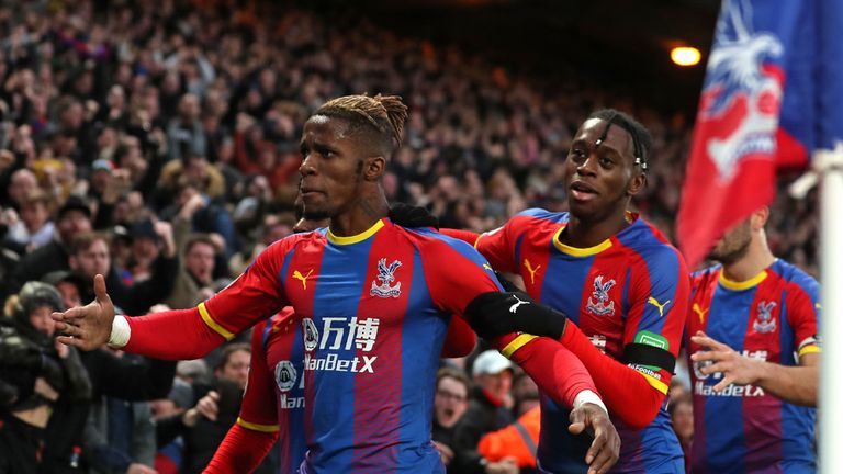 Wilfried Zaha celebrates with Crystal Palace team-mates