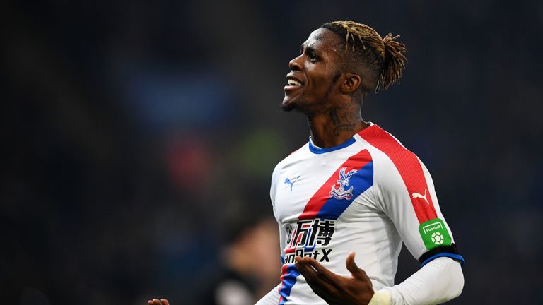 Wilfried Zaha celebrates firing Crystal Palace back in front against Leicester