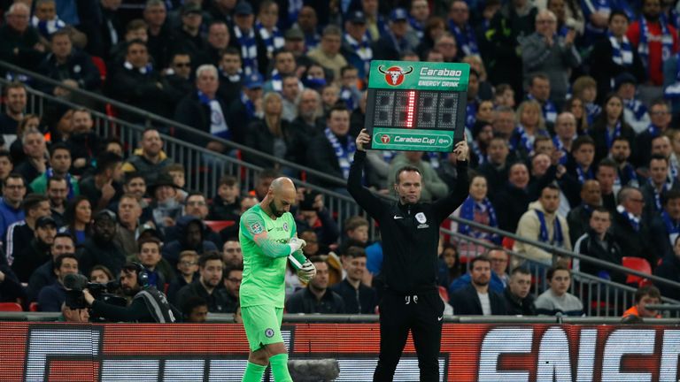 Willy Caballero waits for Kepa Arrizabalaga to leave the pitch after his number is raised by the fourth official