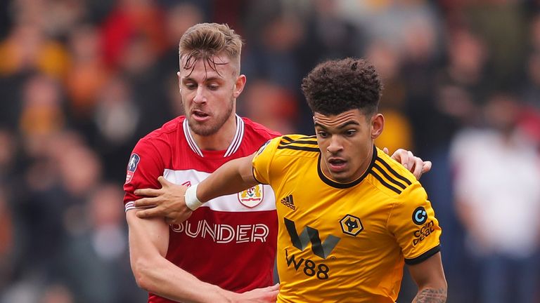 Morgan Gibbs-White tries to get past Adam Webster