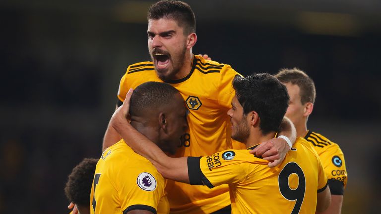 Wolves players celebrate Willy Boly&#39;s last-gasp equaliser against Newcastle