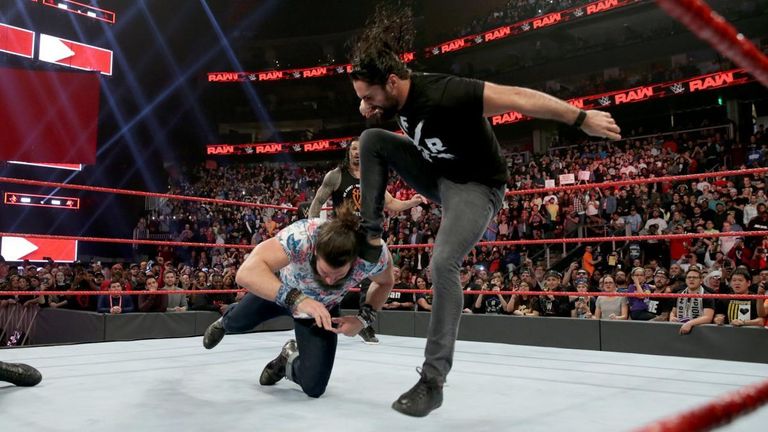 roman reigns and seth rollins save dean ambrose