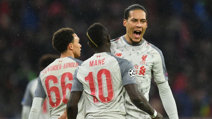 Virgil Van Dijk celebrates with Sadio Mane