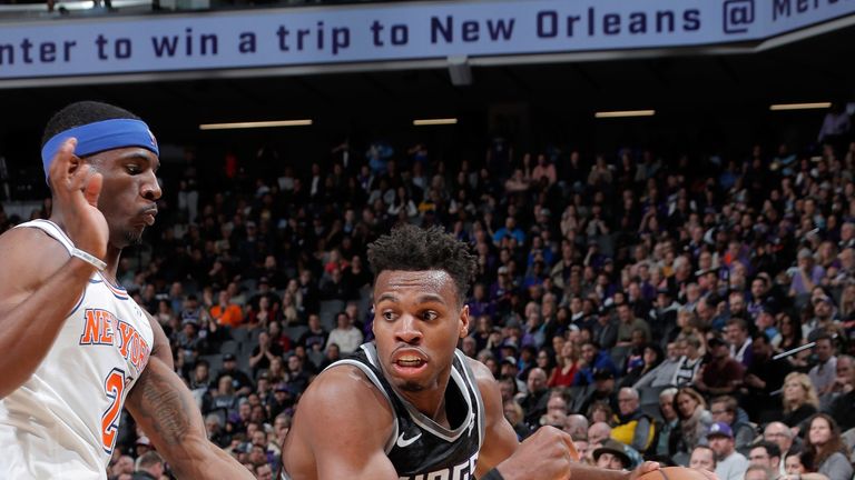 Buddy Hield drives to the basket against the New York Knicks