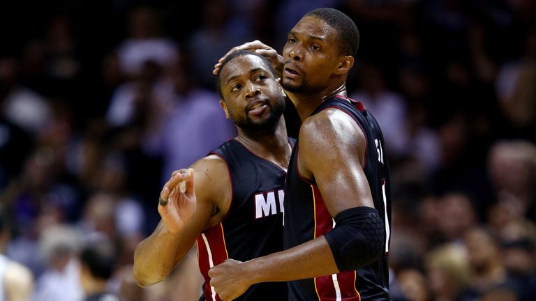 Dwyane Wade embraces Bosh during the Miami Heat glory days