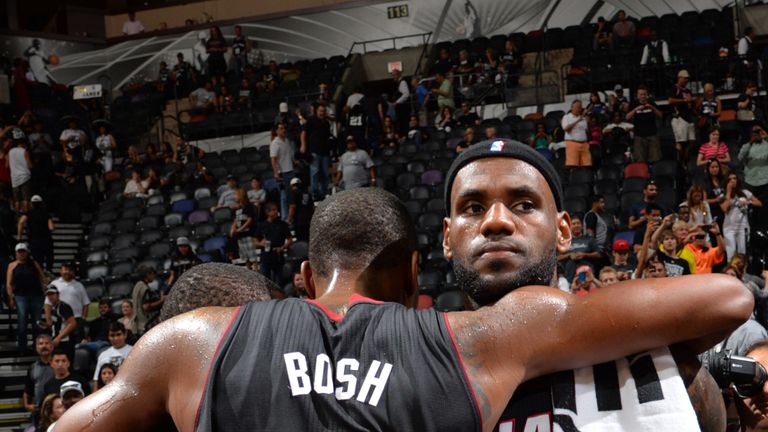 Chris Bosh celebrates a Heat title with Wade and LeBron James