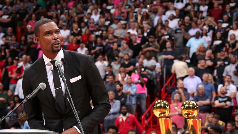 Chris Bosh addresses the Miami fans in front of the two NBA titles he helped the team win