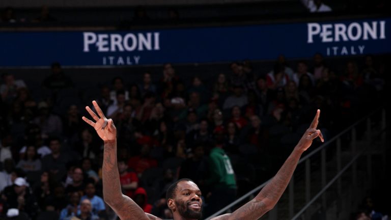 Dewayne Dedmon celebrates a three-pointer for Atlanta